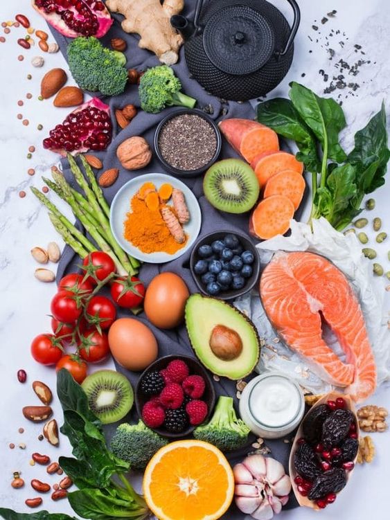Stock image of fresh fruits and vegetables, nuts and seeds. Holistic eating